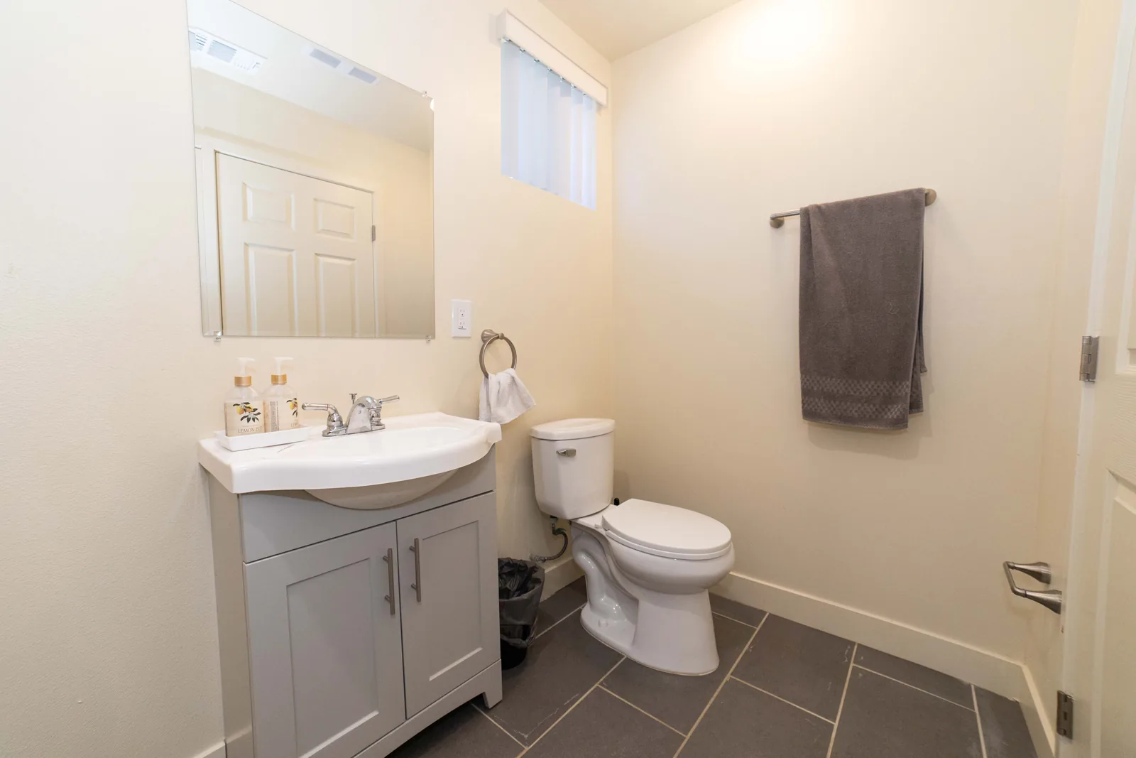 Vanity sink toilet and towel rail in a shared bathroom at the East 54th Street house
