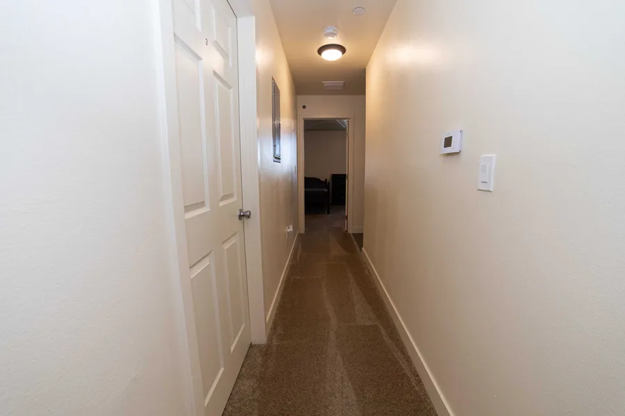 Hallway leading to the shared bedrooms at the East 54th Street house in Los Angeles