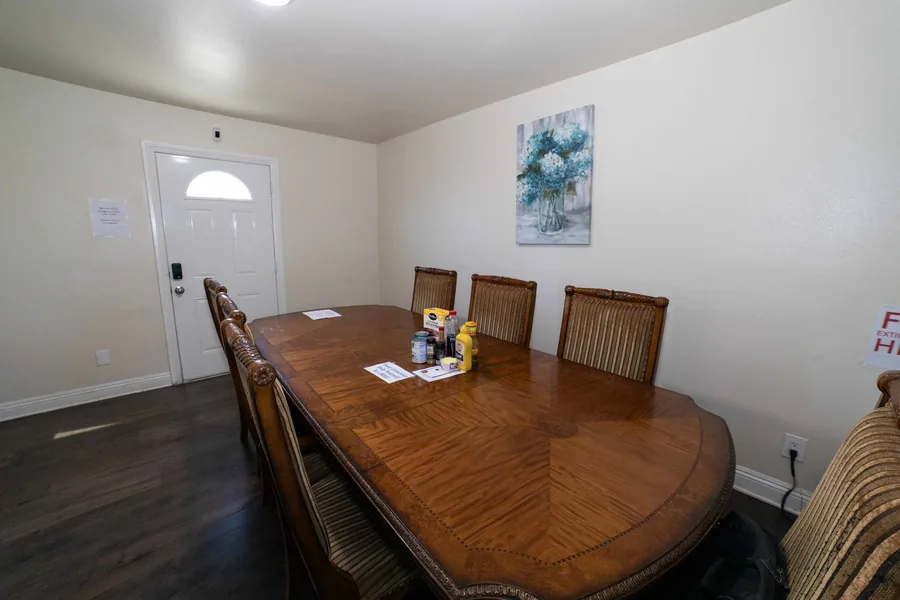 Dining area in the West 42nd Street upper unit with an oval wooden table and cane back chairs